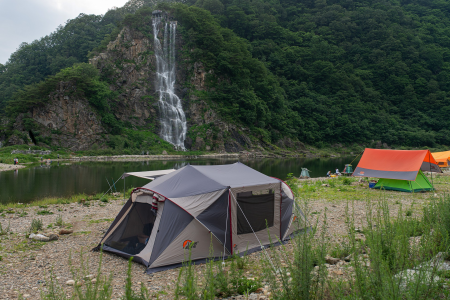best cabin tent with screen room setup along the water
