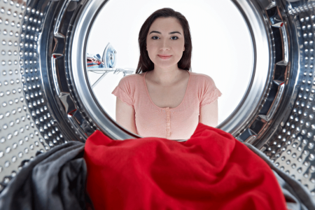 woman-looking-into-a-front-loading-washing-machine